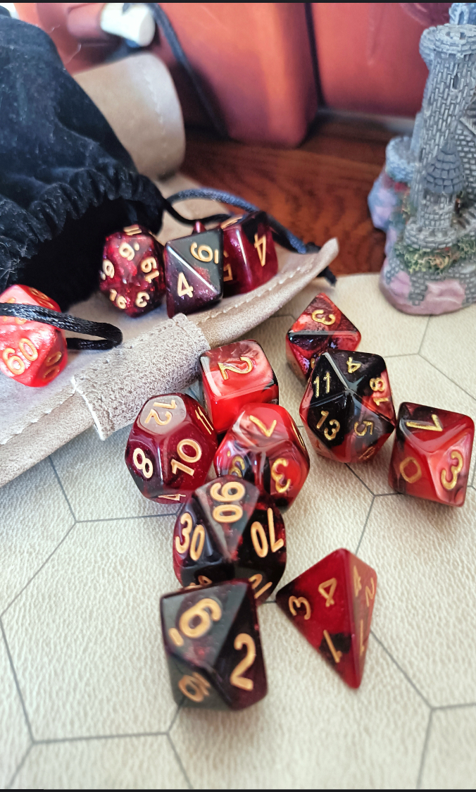 Polyhedral dice spilling from a bag on a gaming table